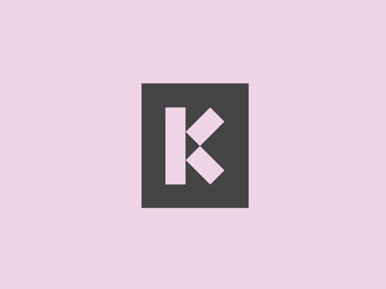 The Kemitt logo features a bold, orange square background with a large white letter "K" at the center. The "K" is uniquely designed, with a straight vertical line on the left and two diagonal lines extending towards the top right and bottom right, resembling an abstract representation of the letter. The design is simple yet striking, with a modern, minimalist aesthetic that employs solid, flat colors. The contrast between the vibrant orange and the pure white creates a sharp visual impact.