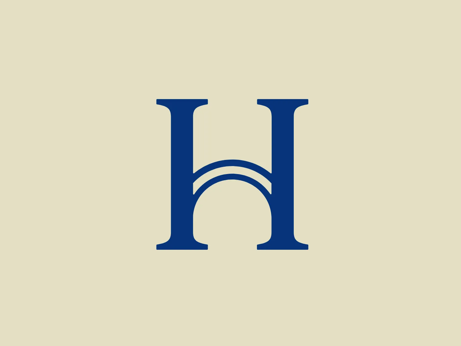 The Harmonia logo features a stylized letter "H" in a deep blue color with the unique design element of an arch connecting the two vertical bars of the "H" at the center, giving it an appearance reminiscent of a bridge. The simplicity of the design allows for versatility, and the bold color choice suggests professionalism and reliability. The font is modern with slight serifs at the ends of the vertical strokes, which adds a touch of tradition to the otherwise contemporary design.