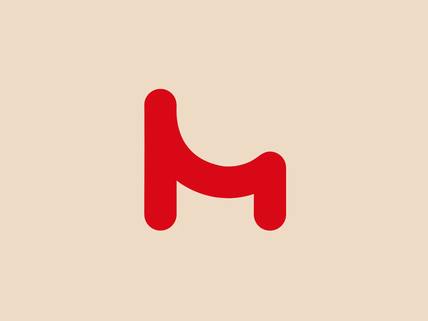 The Nicoletti Home logo features a bold, stylized lowercase letter "h" in vivid red color against a plain white background. The design of the "h" is modern and rounded with soft curves, eschewing sharp angles for a smooth, continuous line. While the overall shape adheres to the recognizable form of the letter, it displays a playful twist in its form with the right leg bending outward, giving it a dynamic and friendly appearance. This design strikes a balance between simplicity and uniqueness, making it easily identifiable and scalable across various applications.