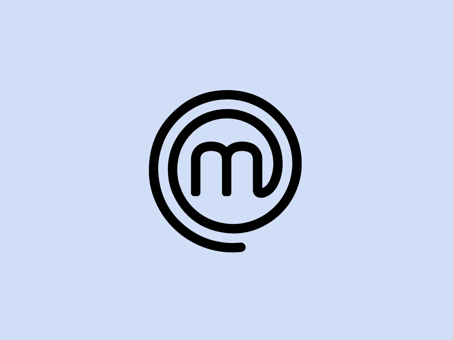 The image showcases a logo composed of a stylized lowercase letter 'm' centrally placed within a series of concentric circles. The design is monochromatic, using black against a white background, which offers a modern and minimalist aesthetic. The 'm' has rounded terminals that echo the curves of the enclosing circles, creating a harmonious and balanced visual effect. The circular motif could suggest inclusivity, wholeness, or a global reach. Notably, the thickness of the 'm' and the circles appears consistent, contributing to MasterChef's cohesive and bold appearance.