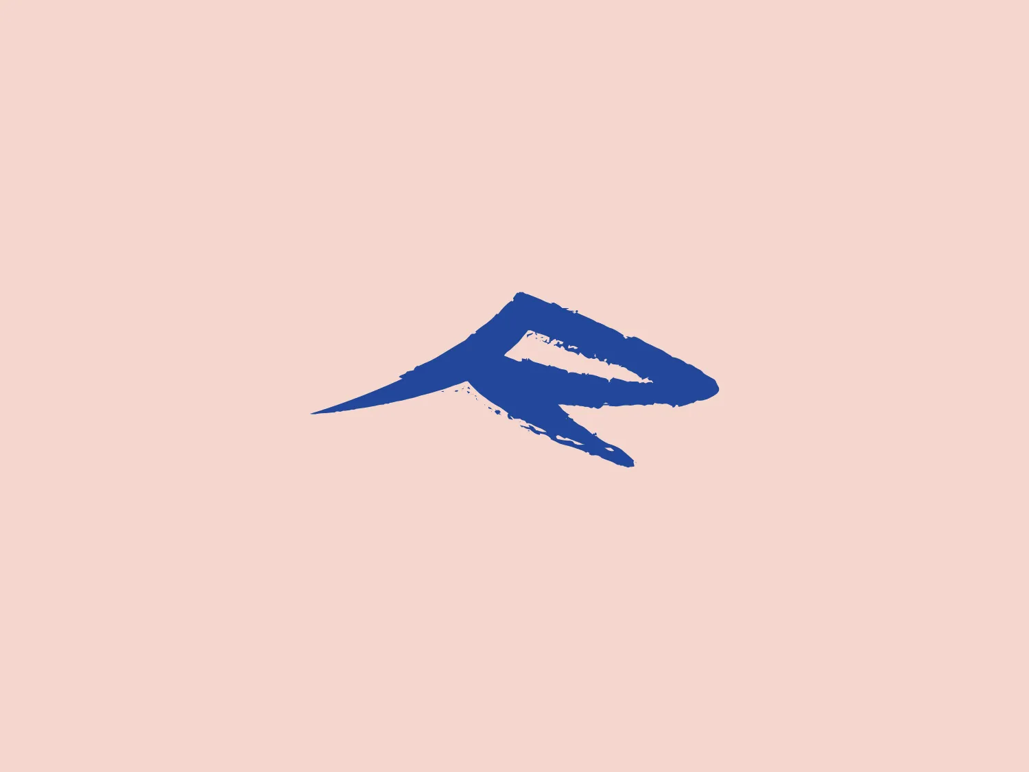 The Revelstoke logo features a stylized, abstract form that appears to be a brush stroke or a dynamic wing-like shape. Its overall design aesthetic is modern and minimalistic, with a singular color choice – a deep, saturated blue. The incorporation of negative space and the sharp angles of the design suggest speed and forward motion, while the texture within the shape gives it an artistic, handcrafted quality. Interesting features include the tapering of the shape's tail and the variance in line width, which add to the logo's sense of energy and movement.
